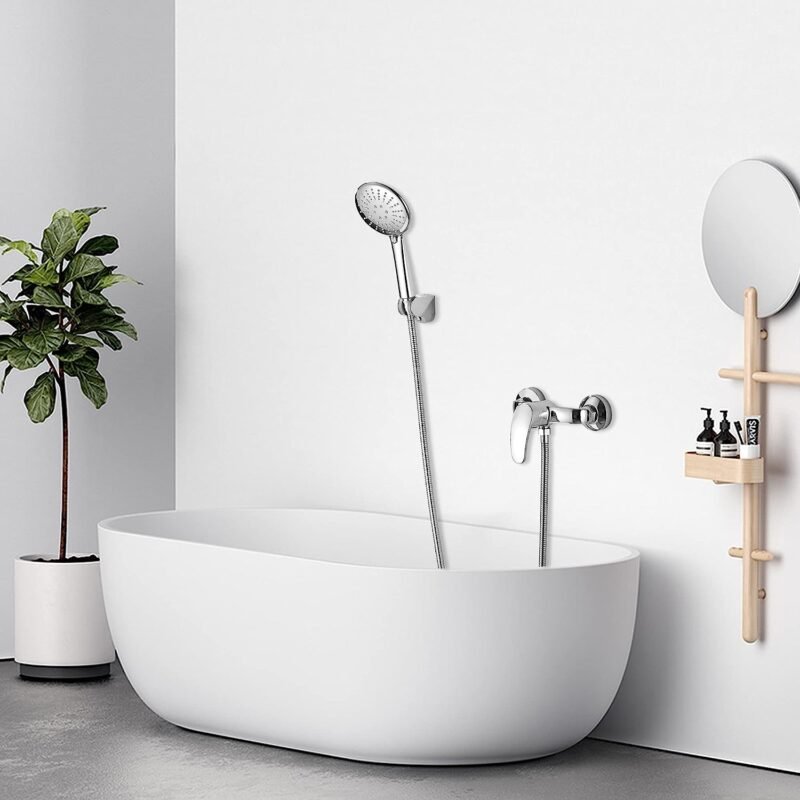 A complete shower mixer set with a rain shower head and handheld sprayer in a luxury bathroom.