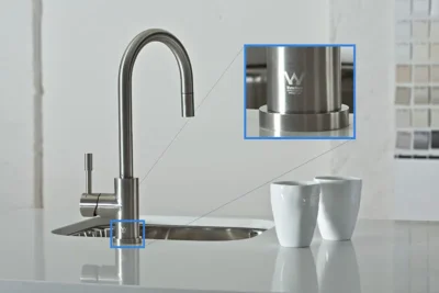 An inspector measuring a faucet component, with global certification logos in the background, symbolizing the verification process for a sanitary ware manufacturer.