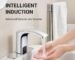 A hand activating a motion sensor faucet, showing the touchless water-saving technology in action.